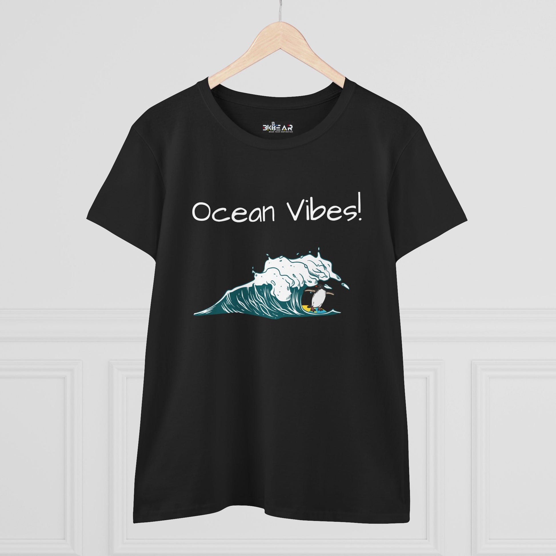 Black Printify t-shirt with ocean vibes text and wave graphic featuring a surfer beach graphic tee