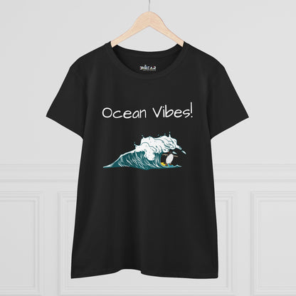 Black Printify t-shirt with ocean vibes text and wave graphic featuring a surfer beach graphic tee