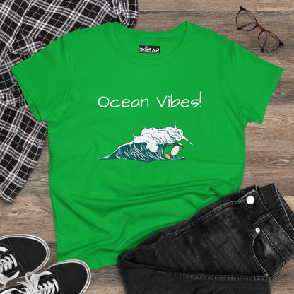 Green Printify T-shirt with ocean vibes beach graphic tee design featuring wave and surfer illustration
