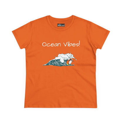 Orange beach graphic tee with Ocean Vibes text and wave surfing design by Printify