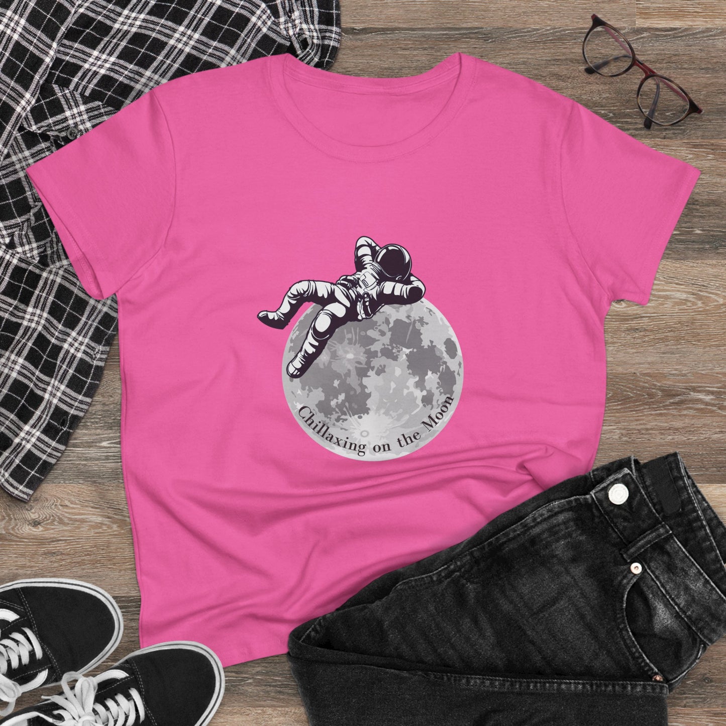Pink moon t-shirt women featuring an astronaut relaxing graphic with casual outfit