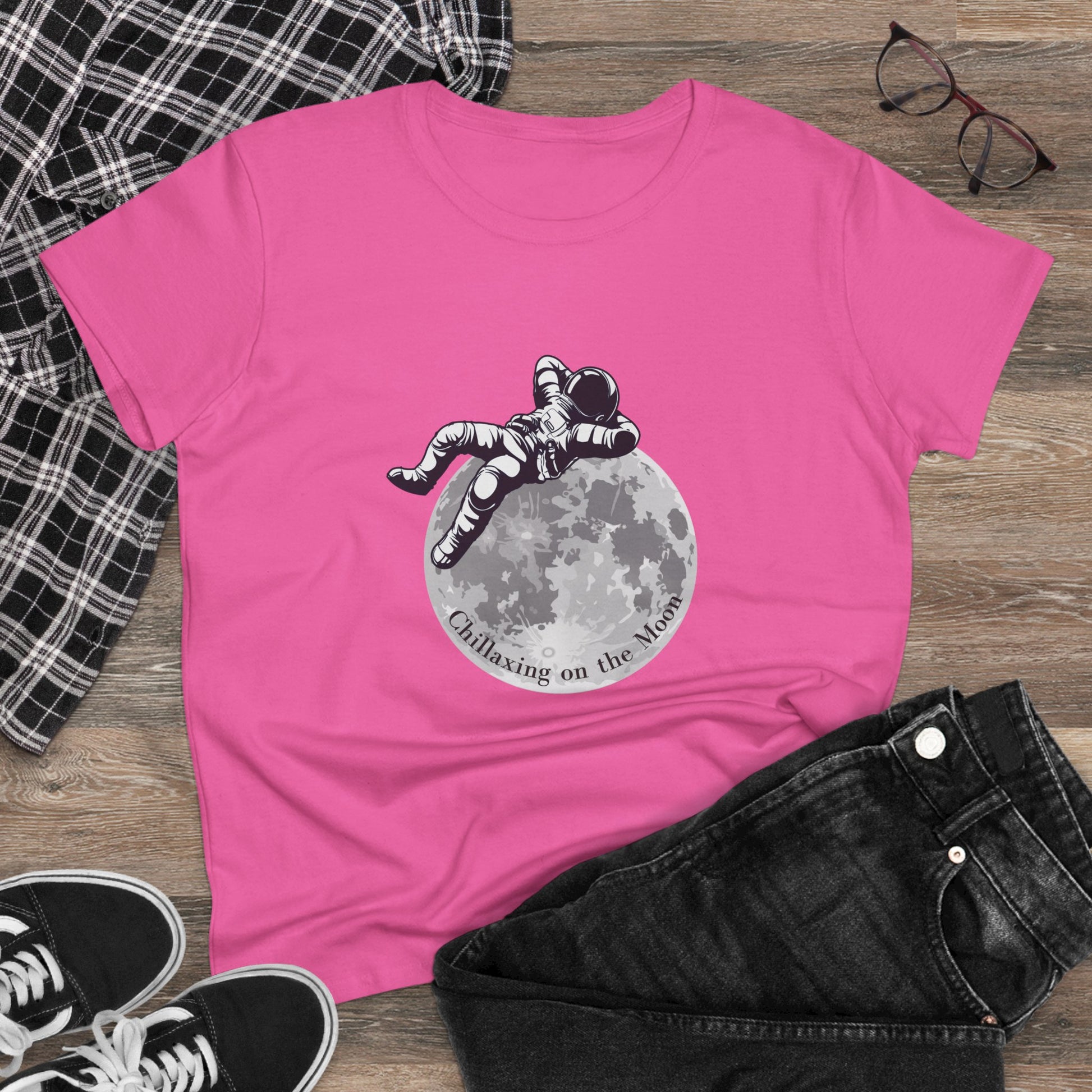 Pink moon t-shirt women featuring an astronaut relaxing graphic with casual outfit