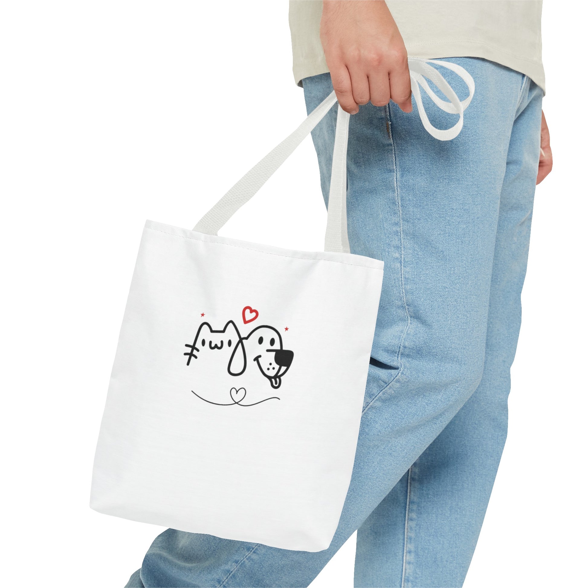 White puppy love graphic tote bag with cute pet illustration held by person wearing light blue jeans