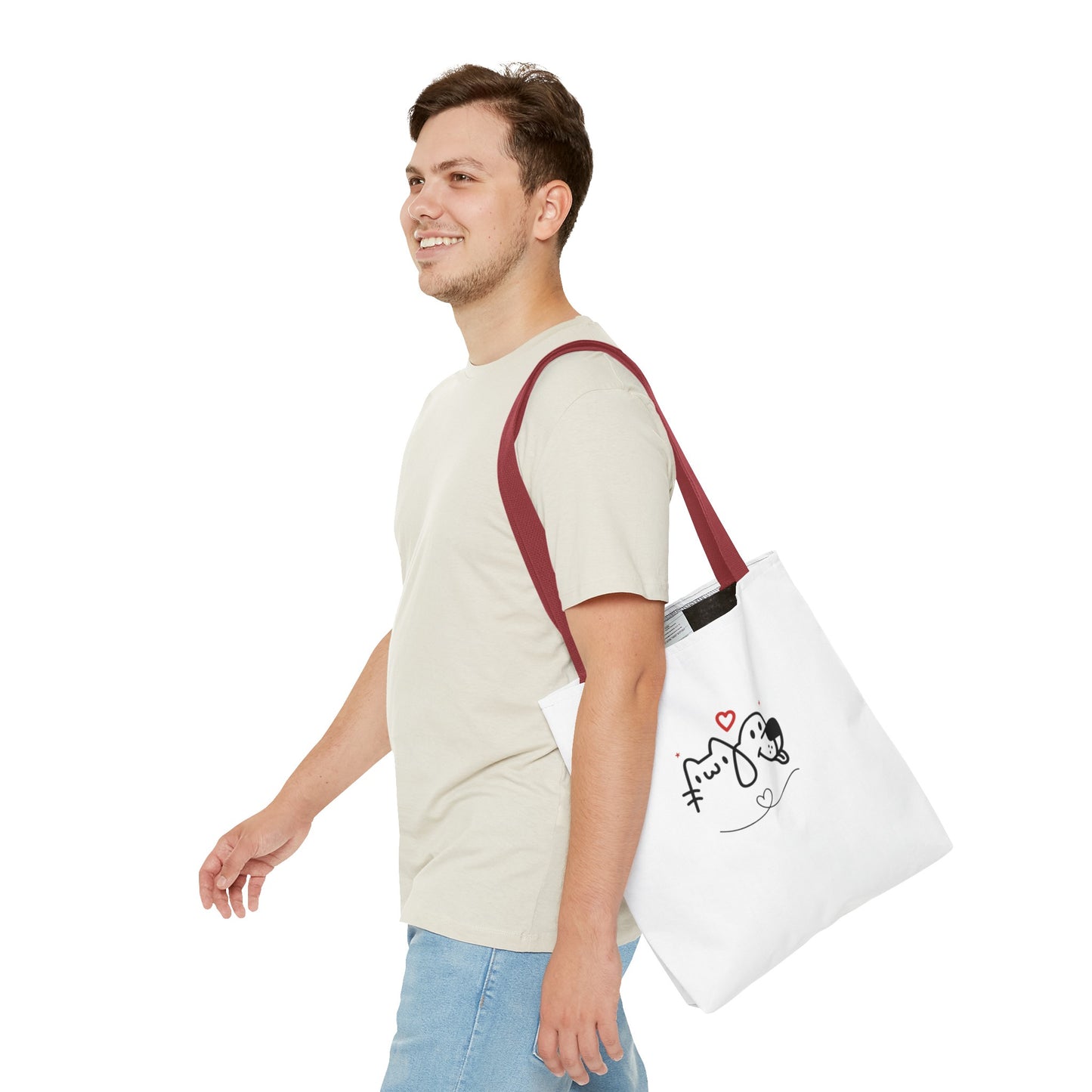 Man carrying a white puppy love graphic tote with maroon straps and cute dog and cat design