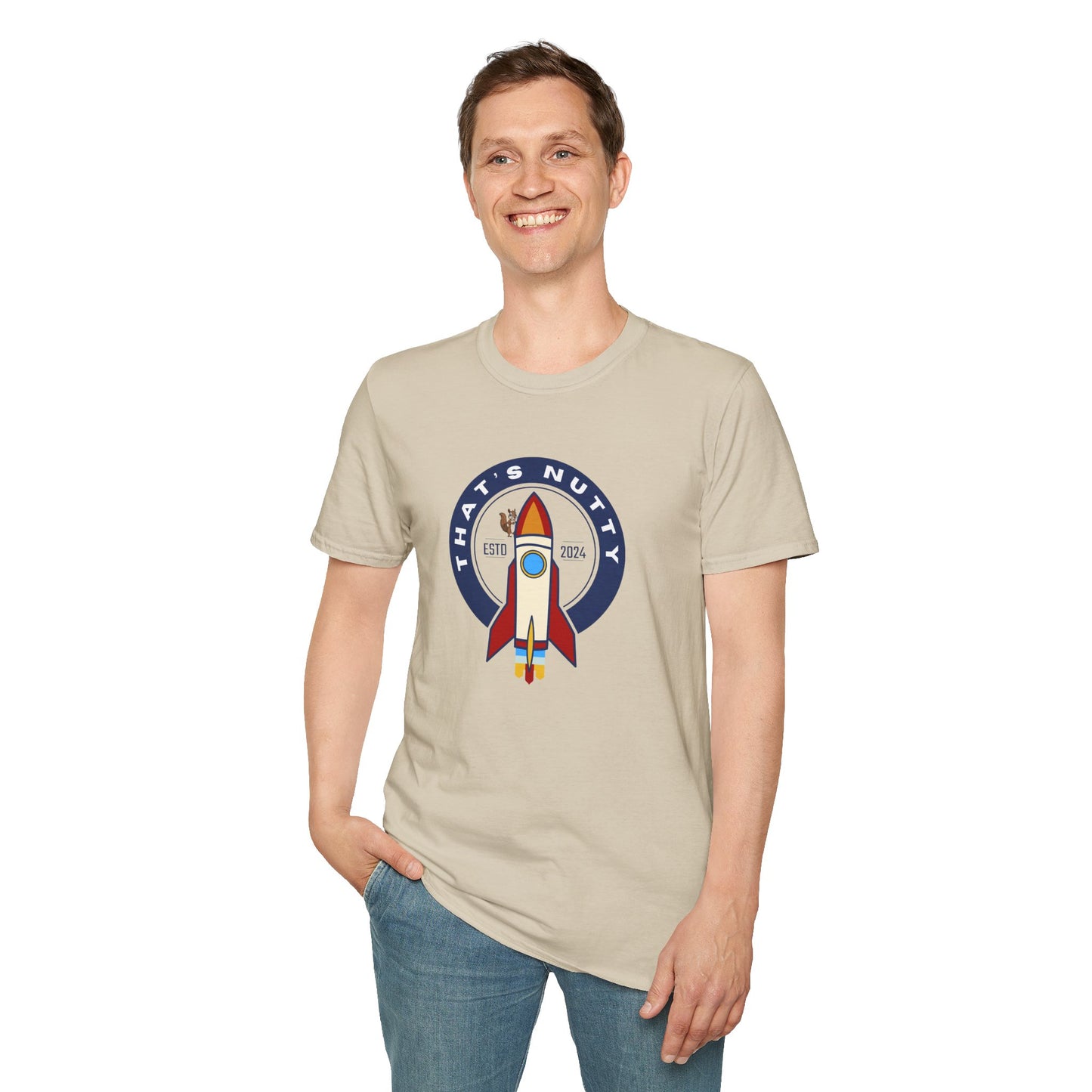 Printify beige rocket ship tee with colorful rocket graphic and text worn by smiling man