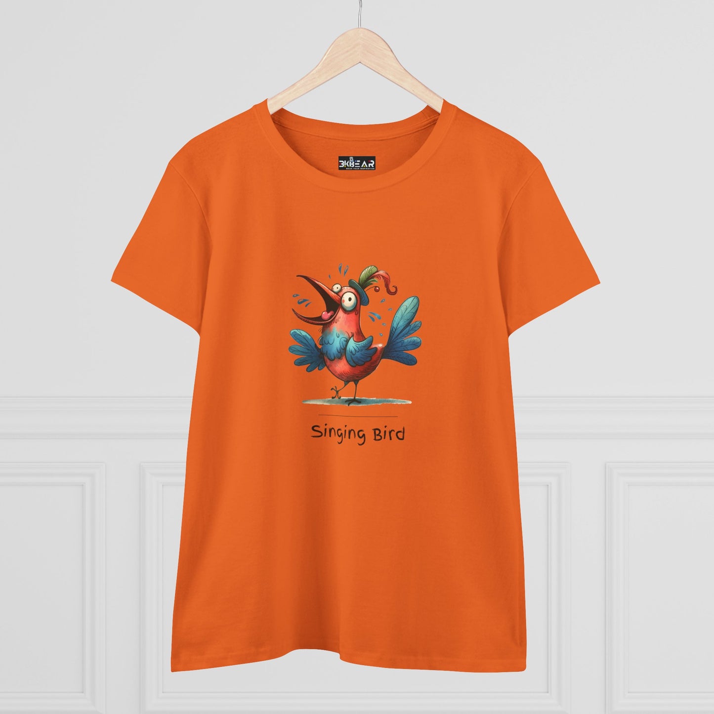 Orange Printify T-shirt with colorful cartoon singing bird graphic and singing bird shirt text