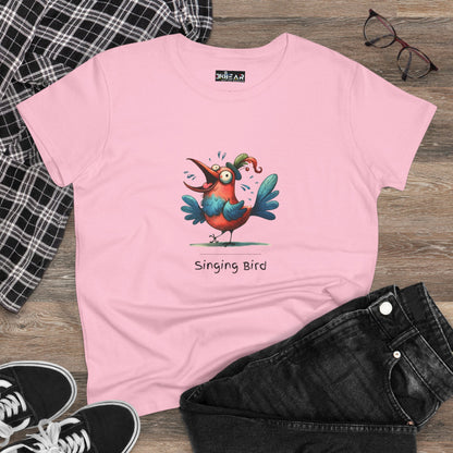 Pink singing bird shirt with colorful cartoon bird design laid flat with black jeans and sneakers