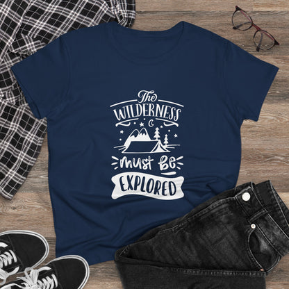 Navy printify wilderness exploration shirt with white outdoor design, displayed with casual clothing and glasses
