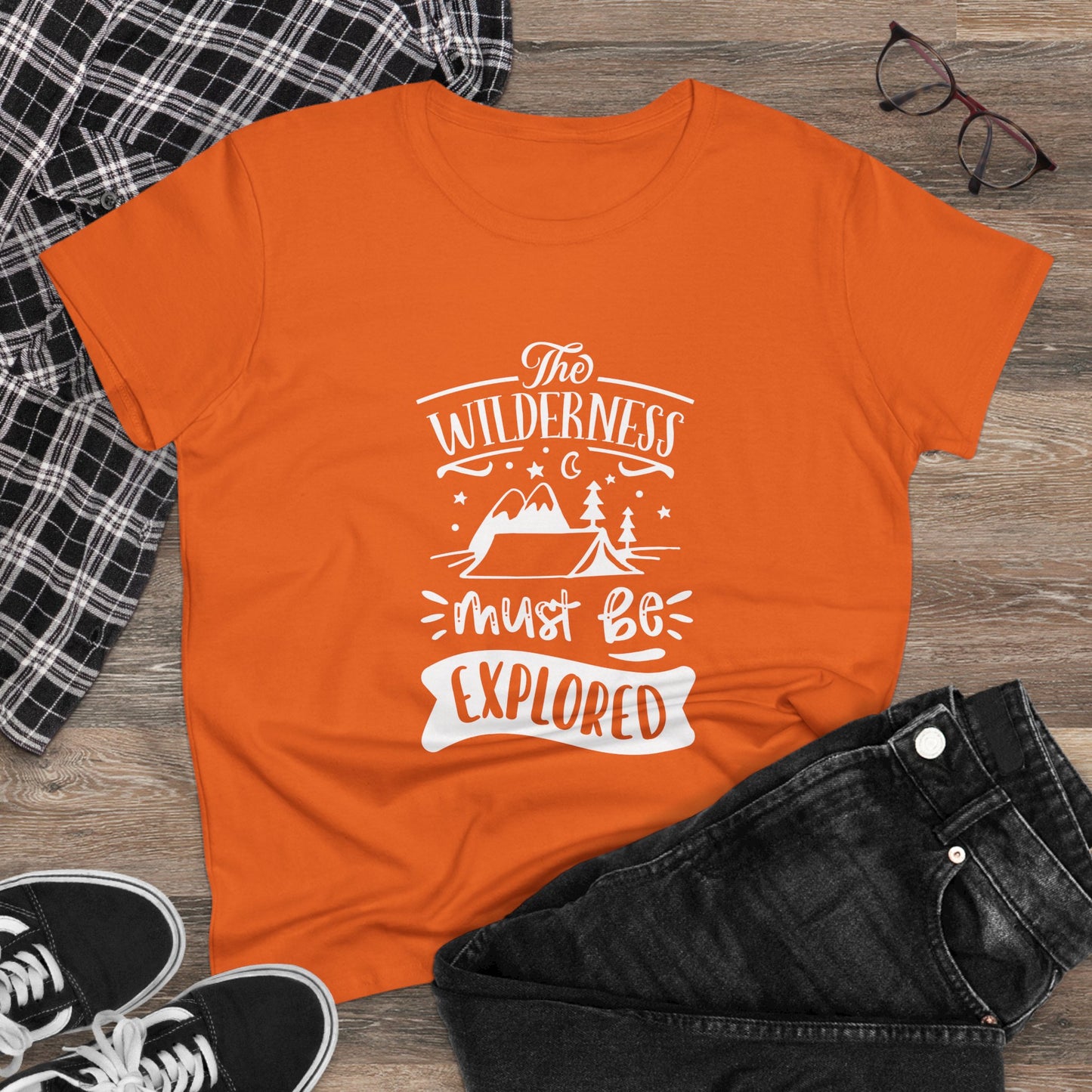 Orange Printify wilderness exploration shirt with white outdoor graphic and motivational text