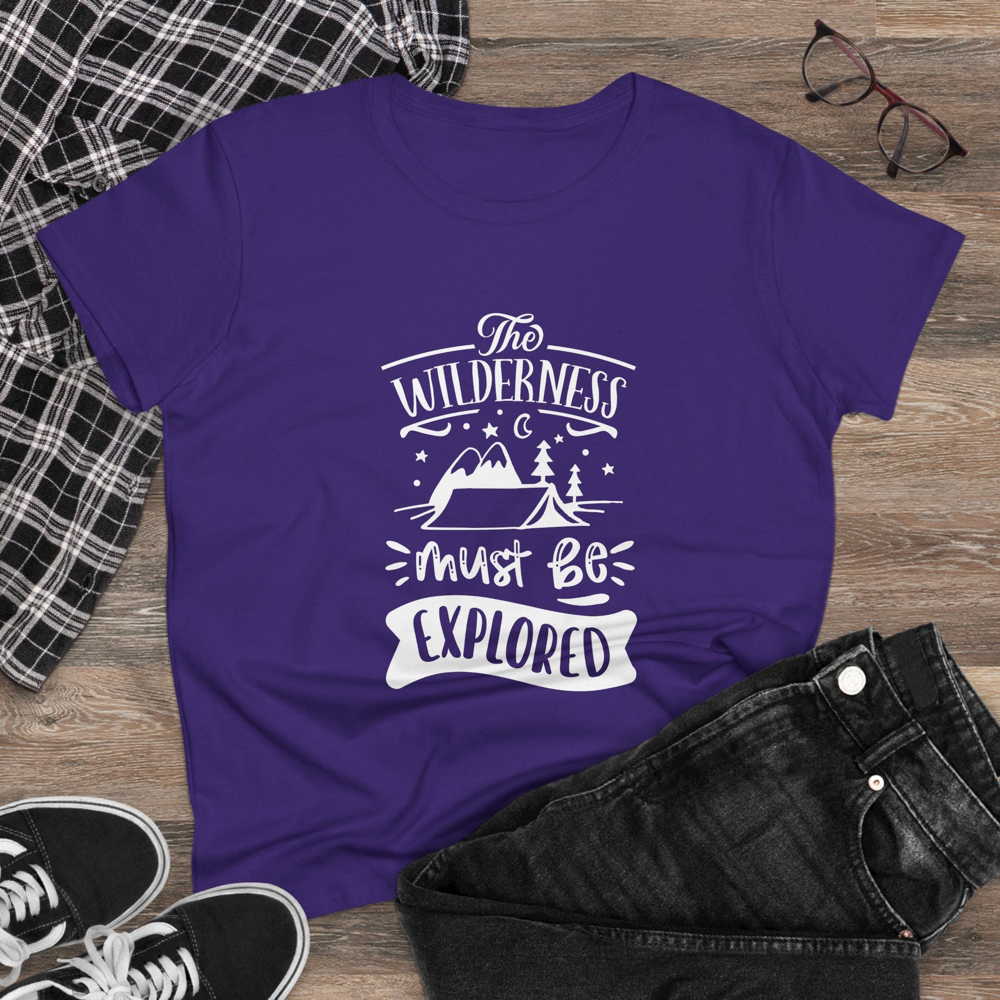 Purple wilderness exploration shirt with white mountain and tent graphic laid out with casual outfit